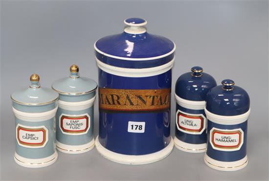 Two ceramic chemists jars and two blue and a large similar jar